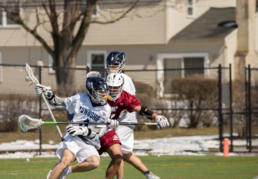 Township senior Owen Miller challenges an Academy of the New Church defender. Photo courtesy of Joyous Snyder.