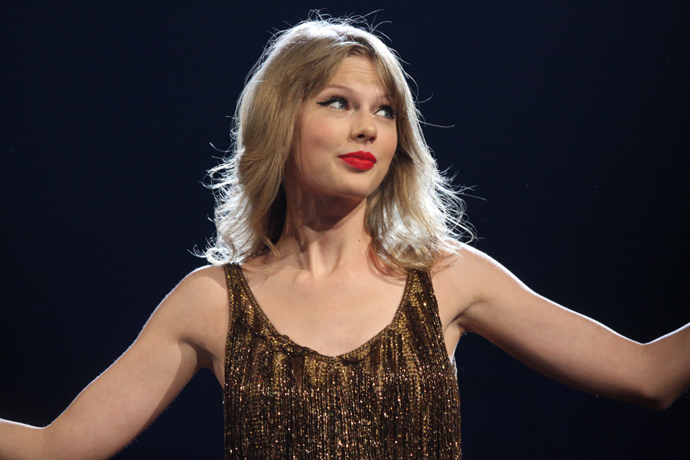 Taylor Swift at her Speak Now Tour in Sydney, Australia. The image file: https://commons.wikimedia.org/wiki/File:Taylor_Swift_%286966830273%29.jpg. Credit to Eva Rinaldi: https://www.flickr.com/photos/evarinaldiphotography/. Link to license: https://creativecommons.org/licenses/by-sa/2.0/. No changes made.