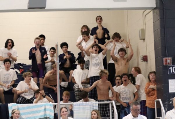 Photo Credit: Jamie Stevens. The swim team cheers for a relay as it finishes.