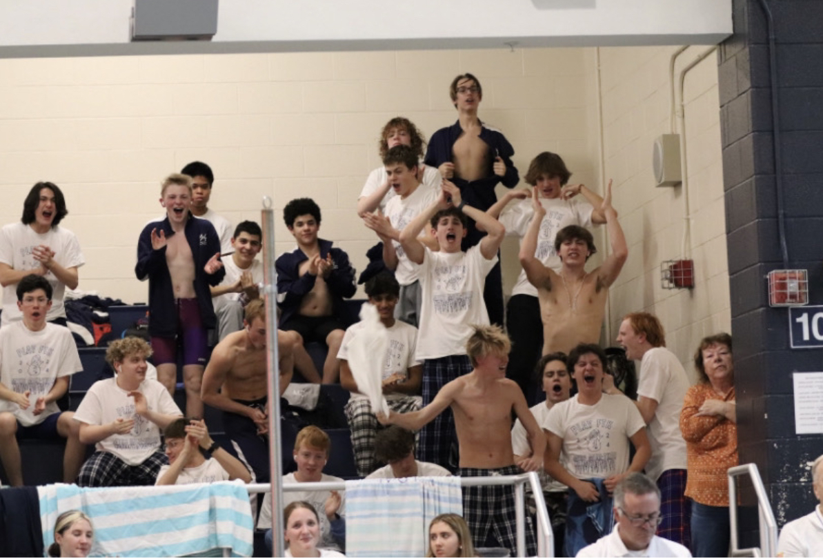 Photo+Credit%3A+Jamie+Stevens.+The+swim+team+cheers+for+a+relay+as+it+finishes.