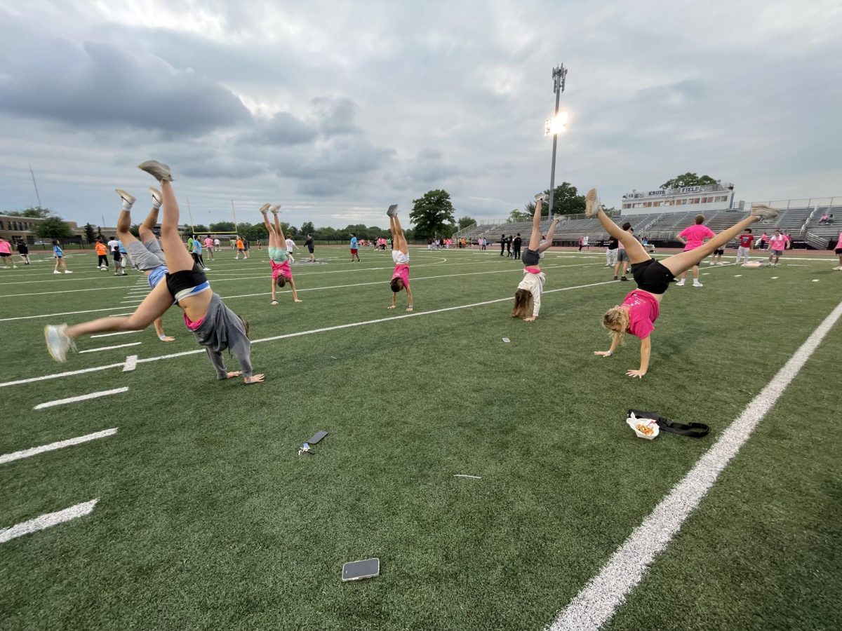 Students show off their handstands at Clash of the Classes. Photo credit to Sabrina Hess.