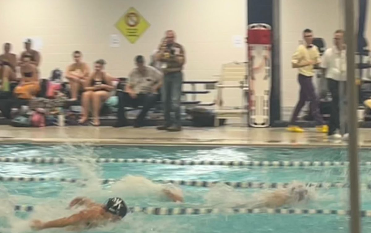 Bram Burge swims the butterfly vs Ephrata in the 200 medley relay. Image via Frankie Booker.
