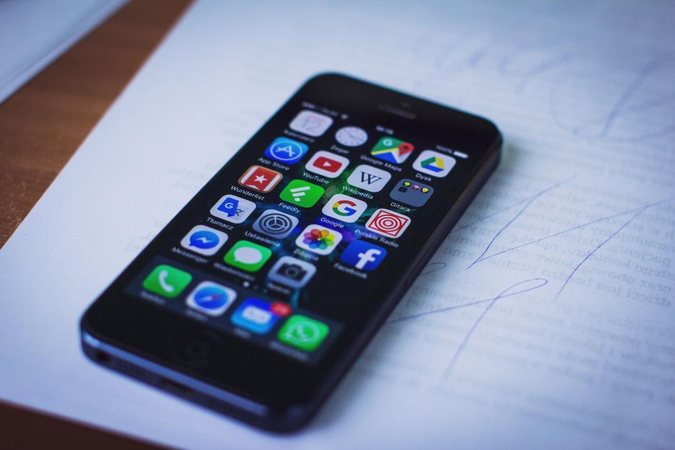 Image Credit: https://freerangestock.com/photos/152943/a-cell-phone-on-a-piece-of-paper.html