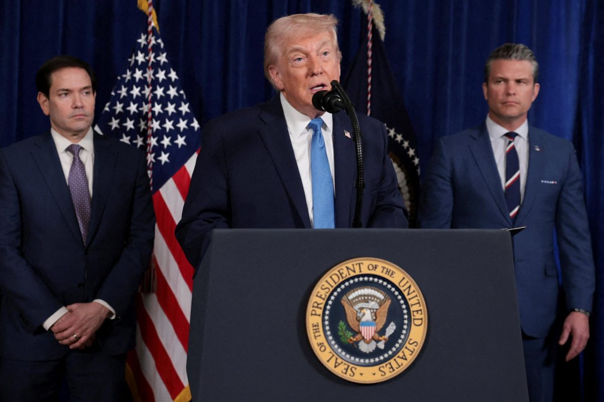 U.S. President Donald Trump speaks as Secretary of State Marco Rubio and Secretary of Defense Pete Hegseth look on during a press conference following a U.S. strike on Venezuela where President Nicolas Maduro and his wife, Cilia Flores, were captured, from Trump's Mar-a-Lago club in Palm Beach, Florida, U.S., January 3, 2026. REUTERS/Jonathan Ernst
