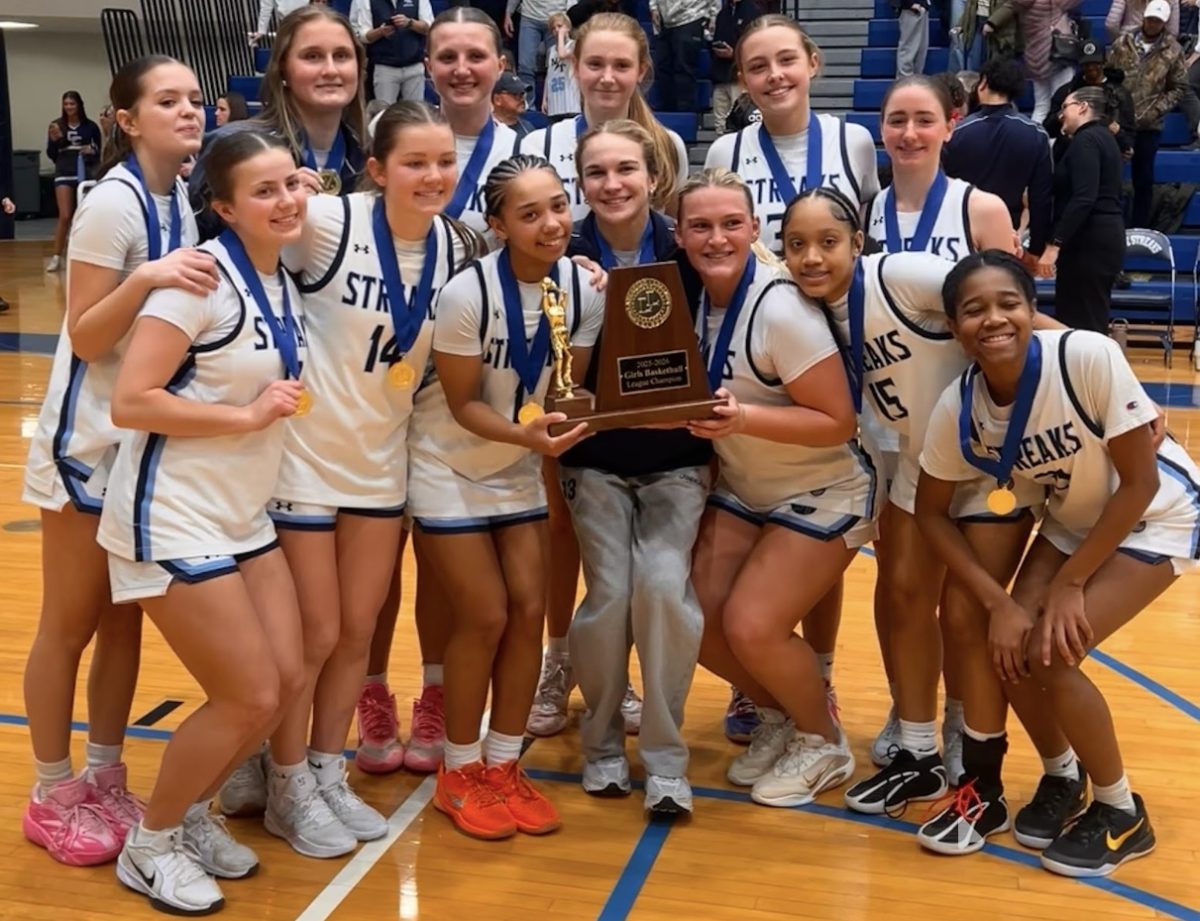 The girls basketball team after their win.