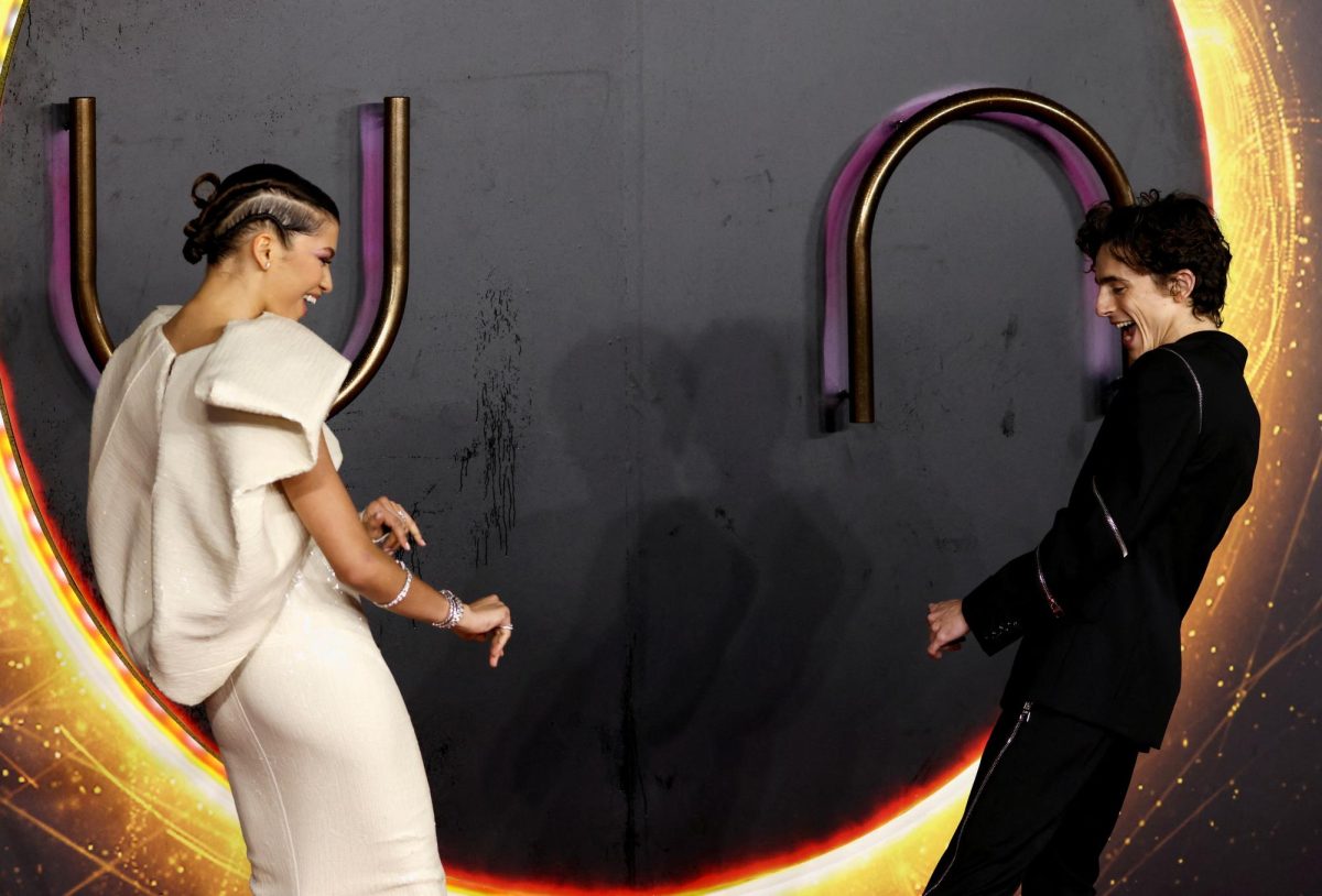 Cast members Zendaya and Timothee Chalamet interact as they arrive for a UK screening of the film "Dune" in London, Britain October 18, 2021. REUTERS/Tom Nicholson