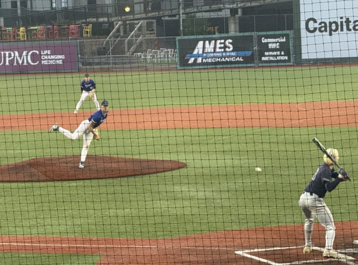Junior Lincoln Stoltzfus (#18) gets a hit early in the game.